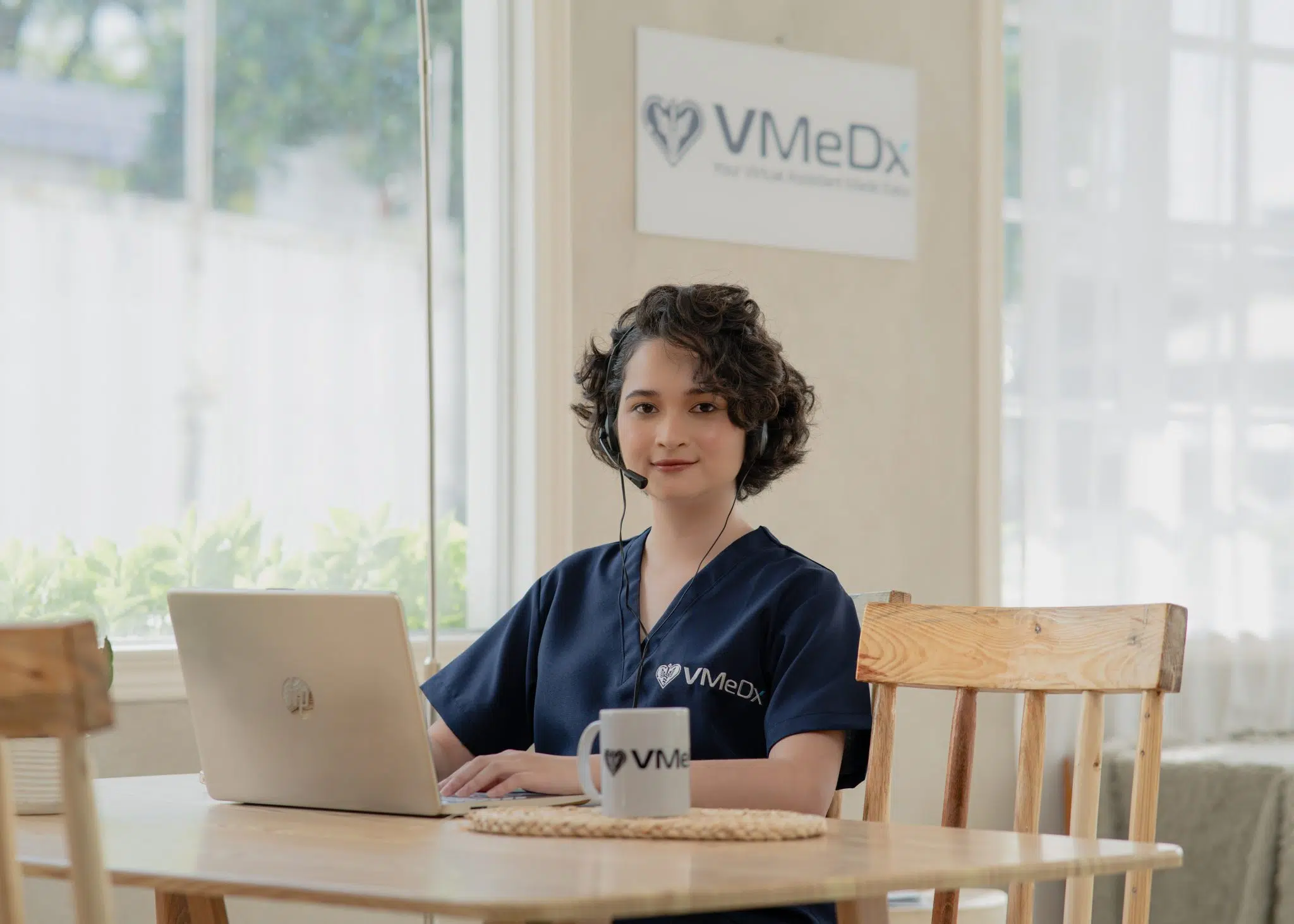 Medical billing virtual assistant working on her laptop.