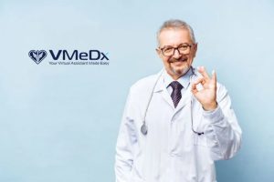 VMeDx doctor smilling showing okay handsign.