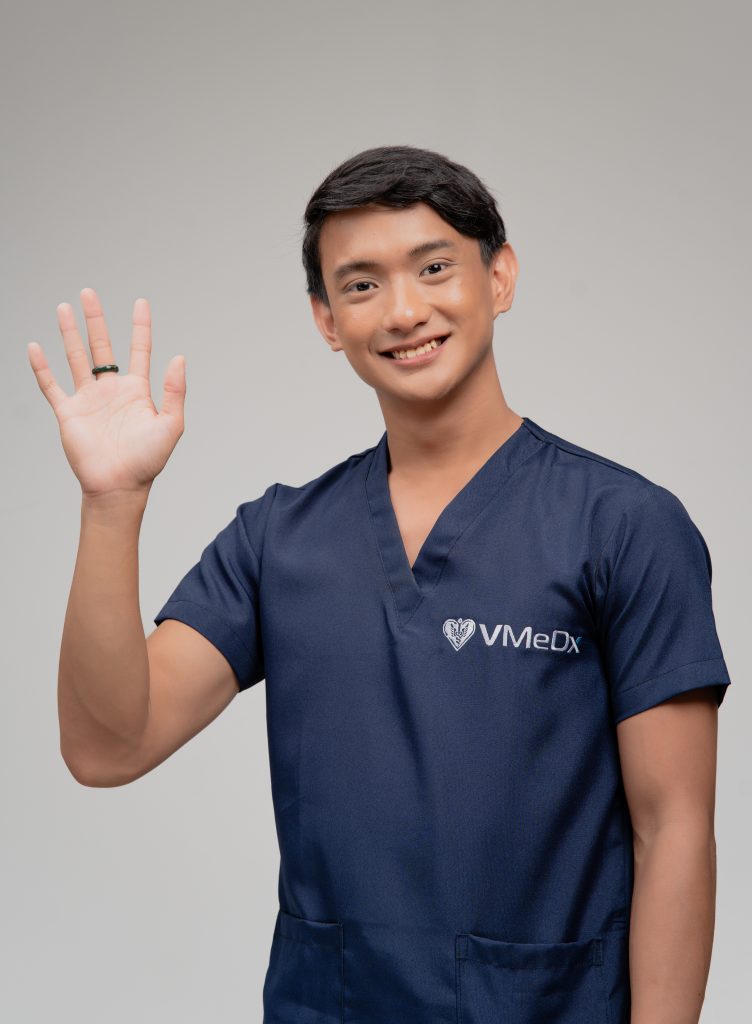 A male prior authorization specialist smiling waving his hand.
