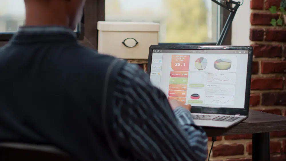 A time-tracking application interface on a laptop screen, with settings for project configuration, healthcare virtual assistant time tracking software