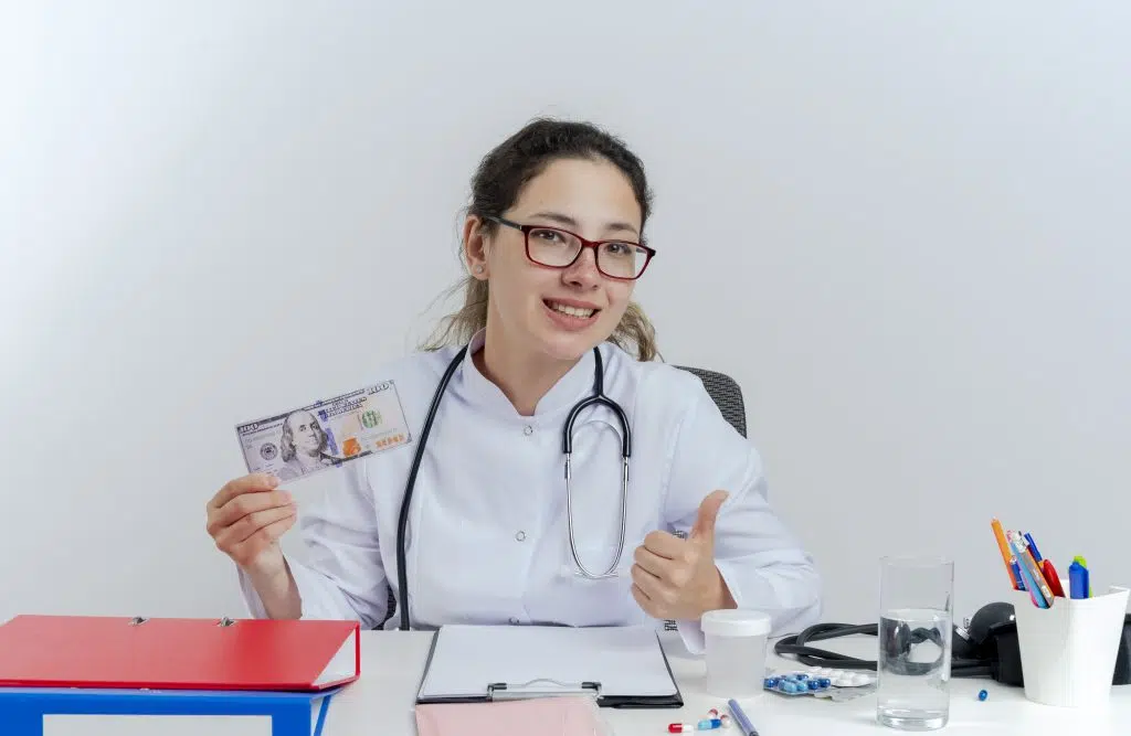 female doctor holding money, virtual medical scribe salary