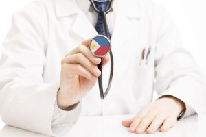 a doctor holding a philippines themed stethoscope
