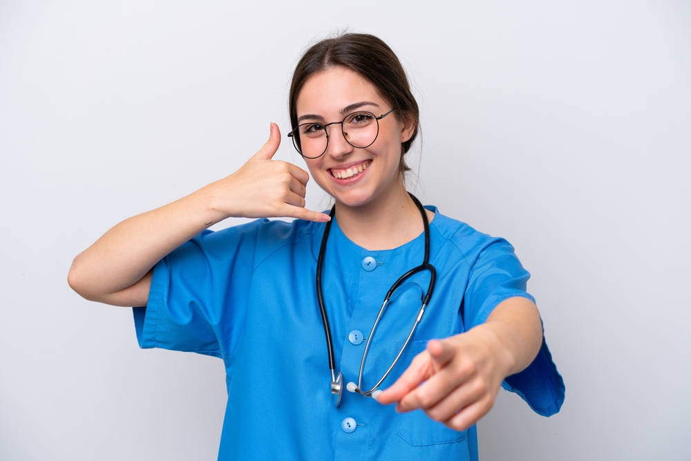 A Virtual Medical Assistant making a phone gesture with one hand while pointing forward with the other.