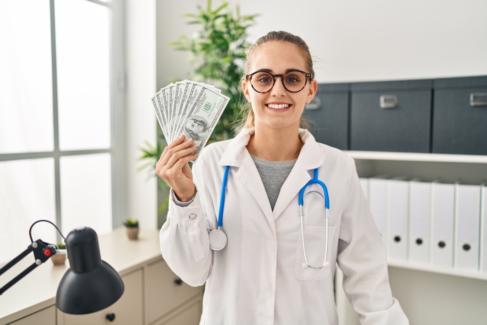 Medical scribe specialist holding a virtual medical scribe salary.