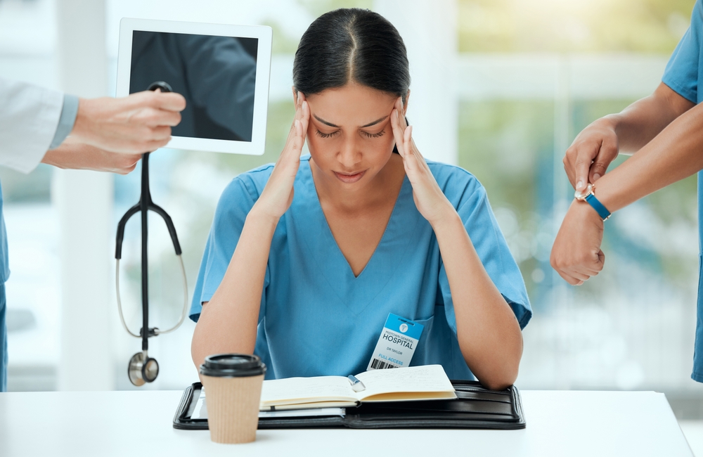 Nurse, hands and woman with stress in office for healthcare deadline, time management and multitasking pressure.