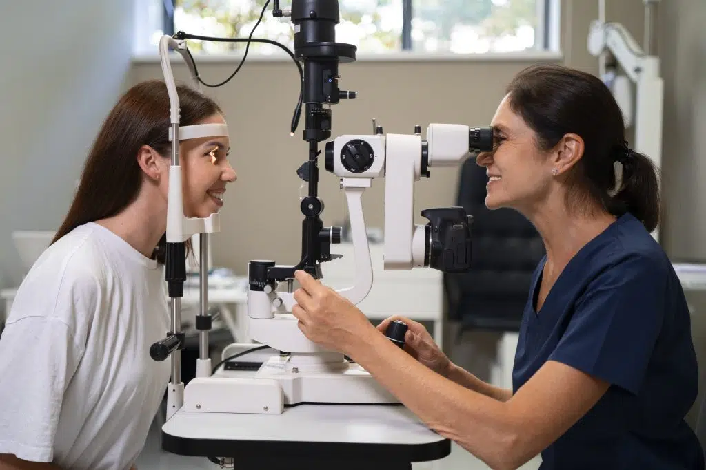 ophthalmologist medical virtual scribe checking a woman's eye