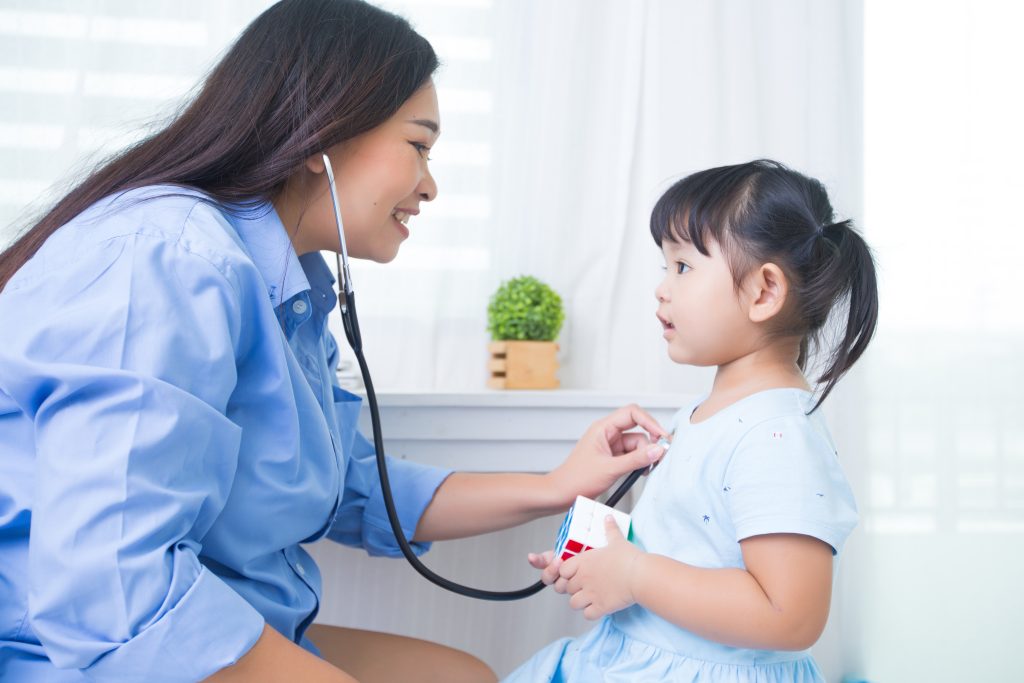 a pediatrician checking a kids heart beat, pediatrics medical virtual scribe