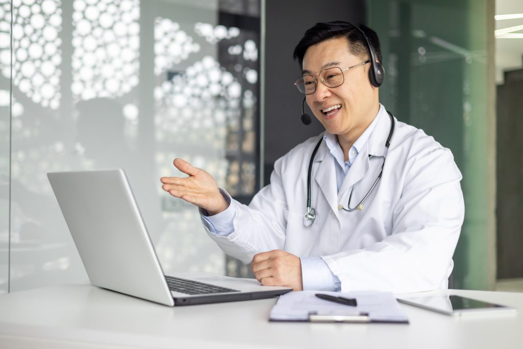 telehealth-ethical-practices-male-doctor-provides-online-consultation-using-laptop-bright-modern
