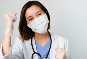 virtual medical assistant benefits in reducing turnover happy young doctor wearing medical mask