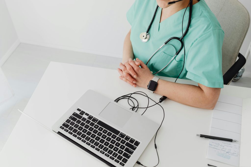virtual medical scribe jobs part time a doctor using a laptop