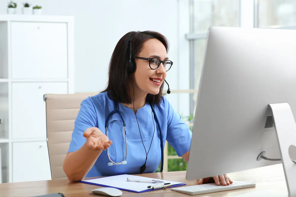 A happy virtual medical assistant working.