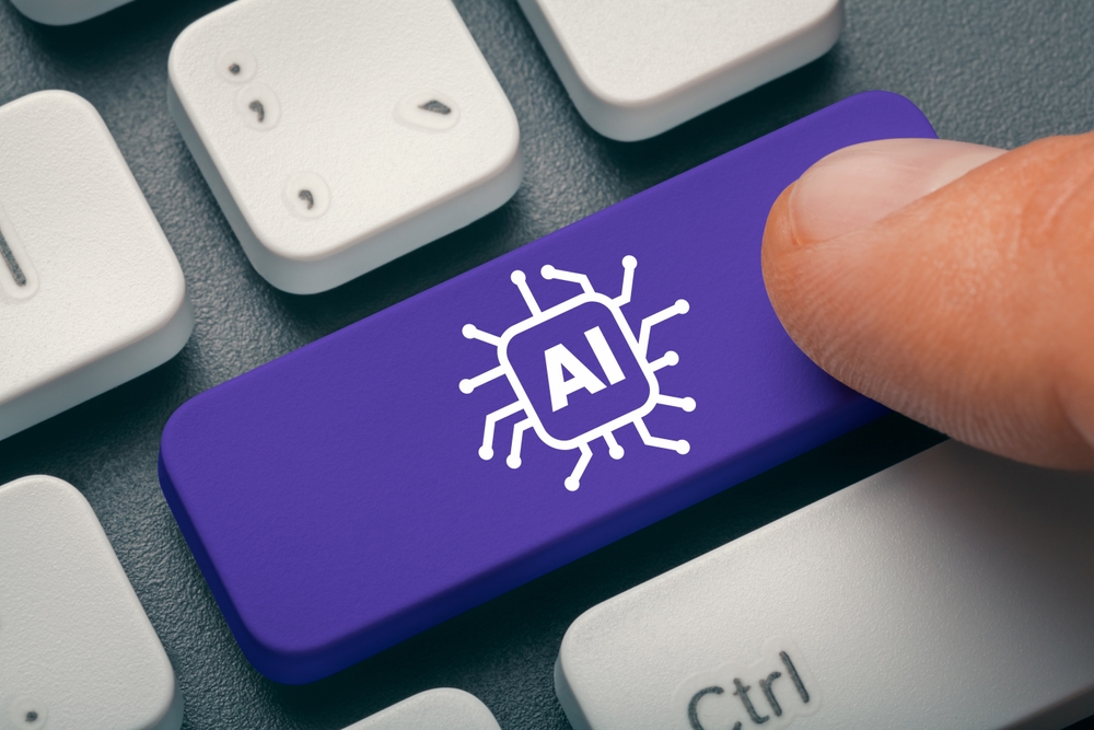 Close up index finger pressing computer key with AI word and symbol, virtual medical scribe.