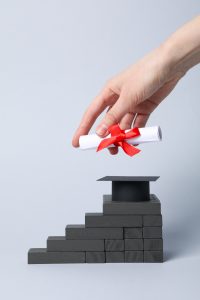 graduation hat, diploma on a stair, medical administrative assistant