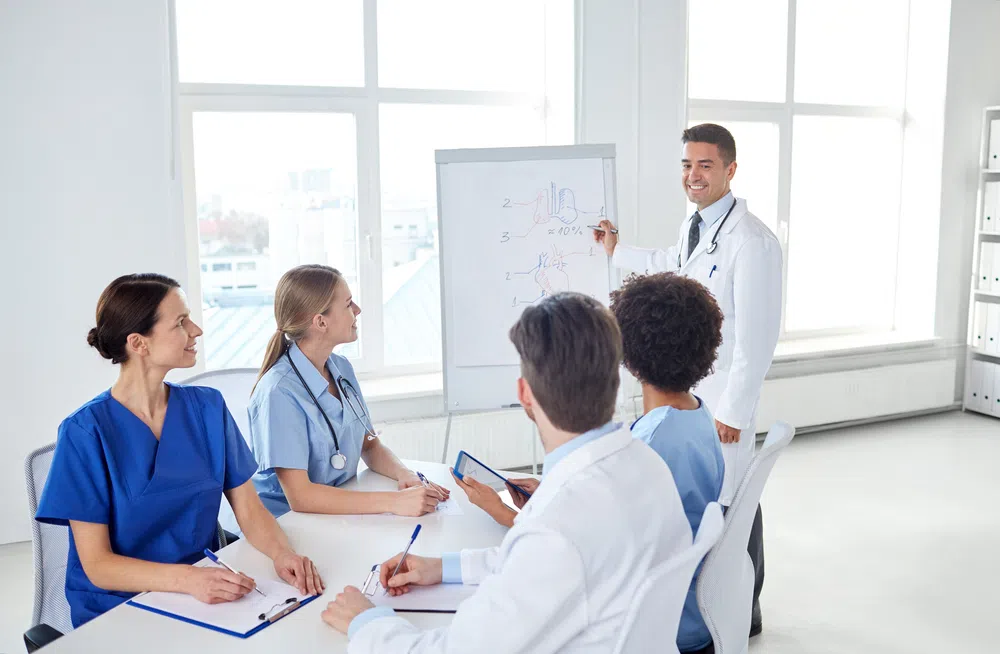  group of happy virtual medical assistants training with mentor meeting .