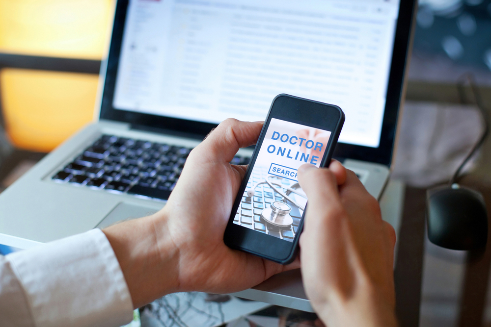 Patient looking for a medical services on the screen of smartphone.