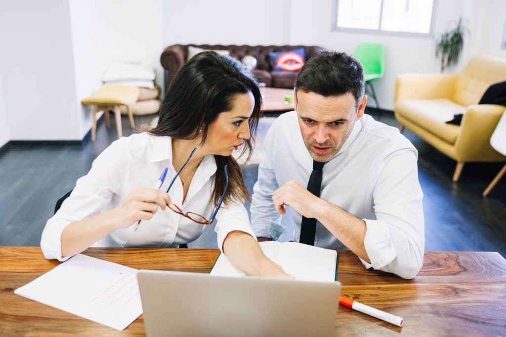 Two people discussing about best medical marketing agency