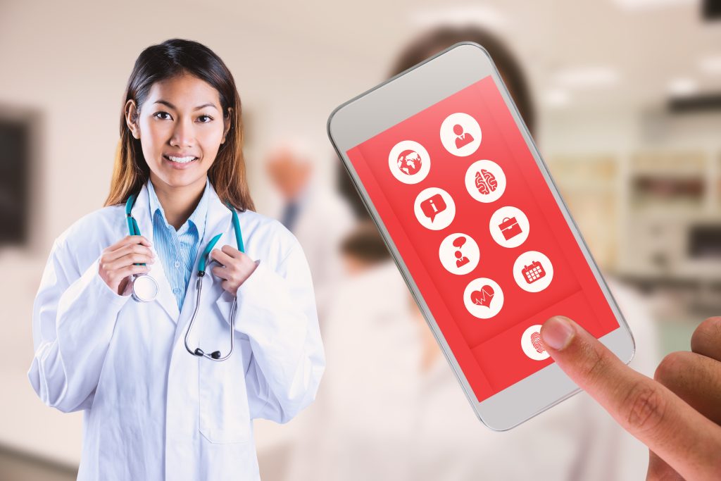 Asian doctor holding stethoscope against pretty science student smiling at camera