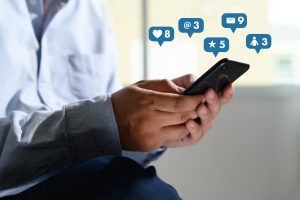 Social media,social network concept with smart phone man phone with social media network diagram, healthcare social media marketing 