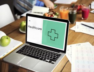 a laptop with a healthcare text in display, website development for doctors 