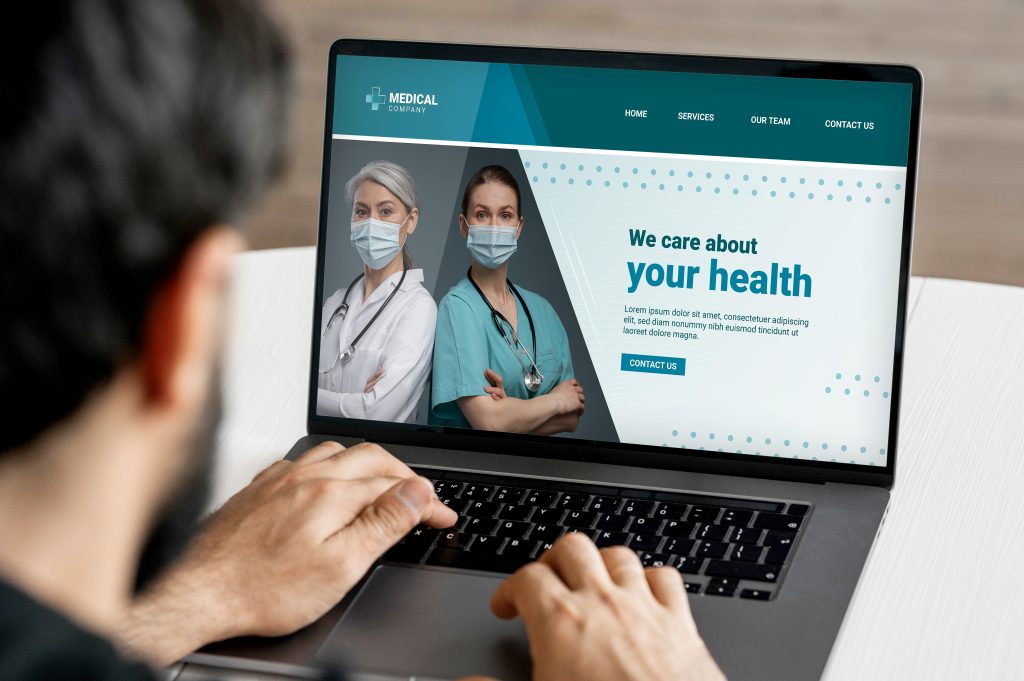cropped picture of a man looking at a medical website, website development for doctors
