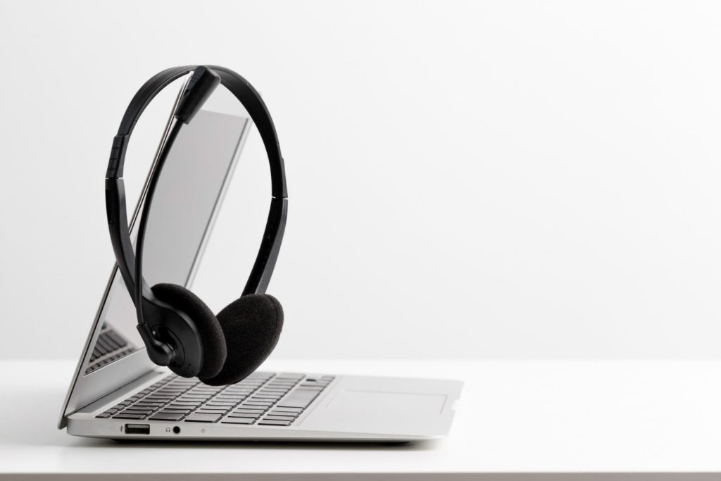Academic transcription services using high-quality headset and laptop.