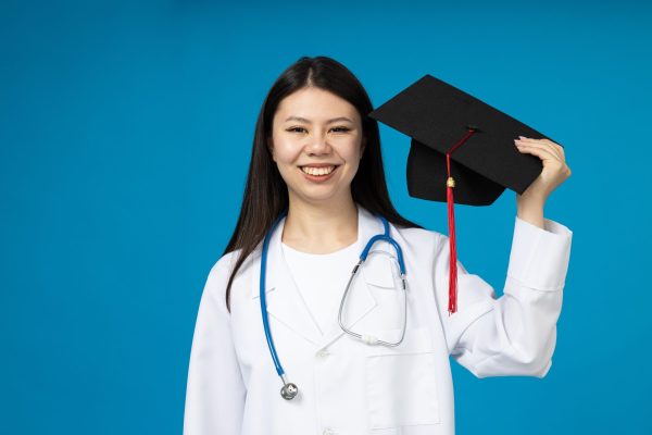 An Asian girl has finished studying to become a doctor