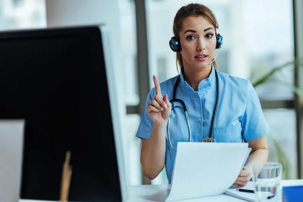 Female VA gesturing toward how to become a medical virtual assistant.