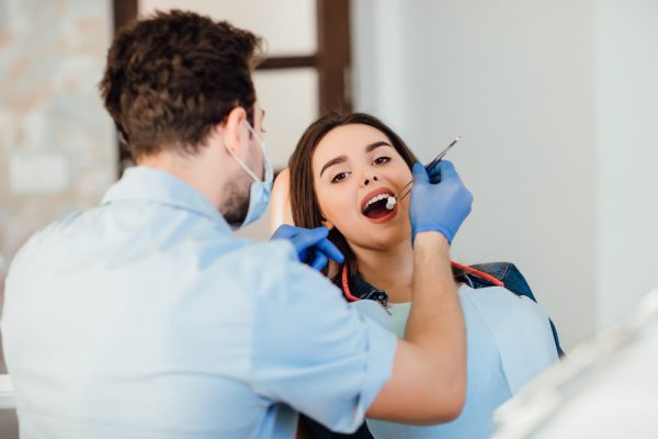 a dental professionals with her client