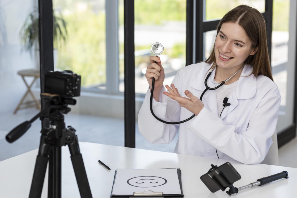 Blogger recording video with medical accessories, live scribing
