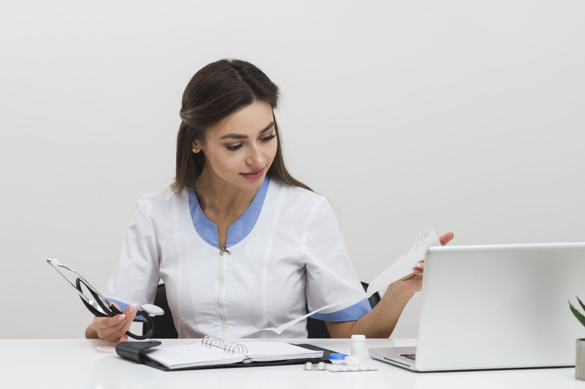 Female transcriptionist complying healthcare reports