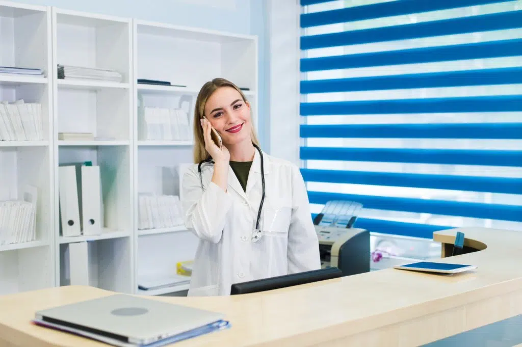 dental receptionists female taking a call