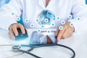 The doctor working in global health network at the table, international patient scheduling services 