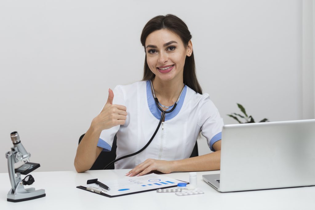 Female doctor sitting and showing ok sign, streamline efficiency receptionist