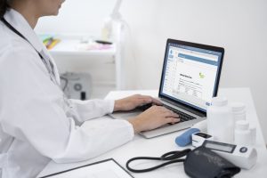 Doctor writing about routine medical checkup, virtual medical message management