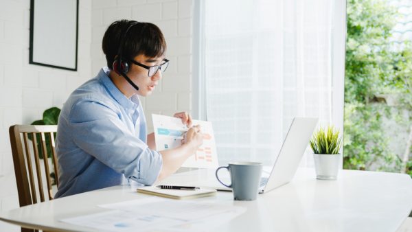 Asian male discussing about what is a virtual medical scribe