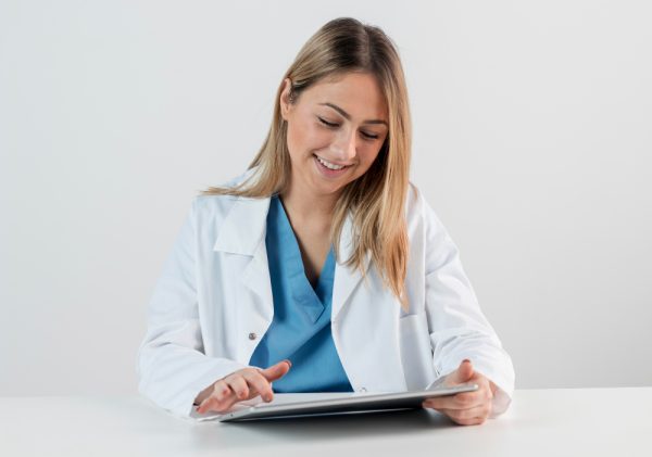 Man Doctor Documenting Medical Procedures Accurately