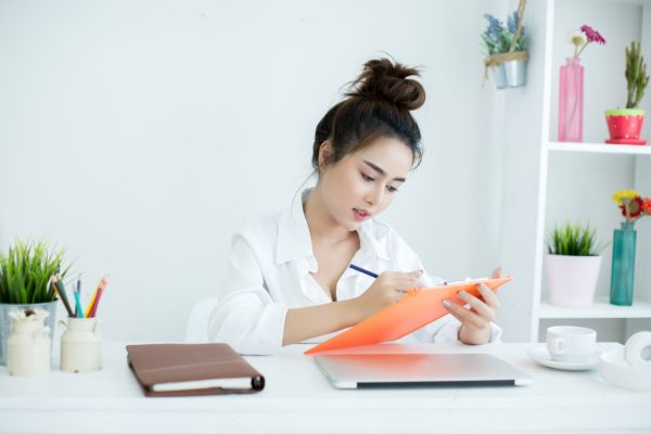 young-woman-working-10-task-as-medical-virtual-assistant-on-laptop