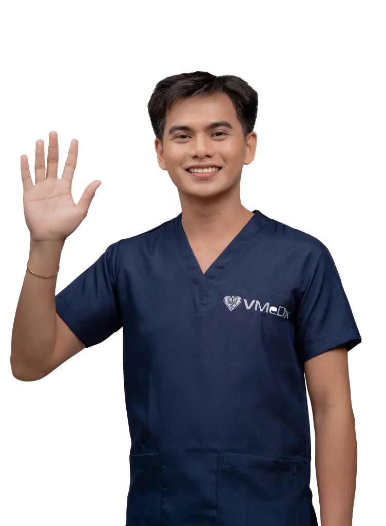 Male-VMeDx-remote-medical-scribe-waving-his-right-hand-to-the-clients-752x1024