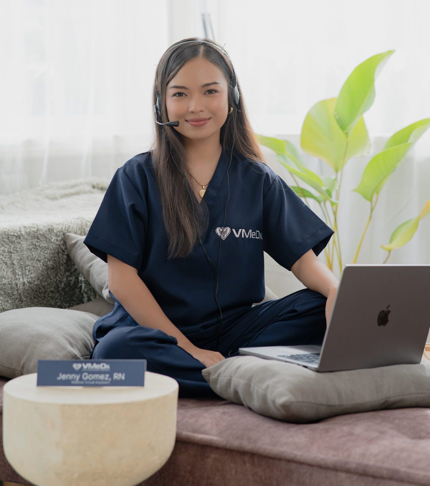 Medical Billing female VA working on her laptop