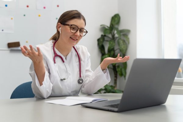 doctor consulting patient on laptop