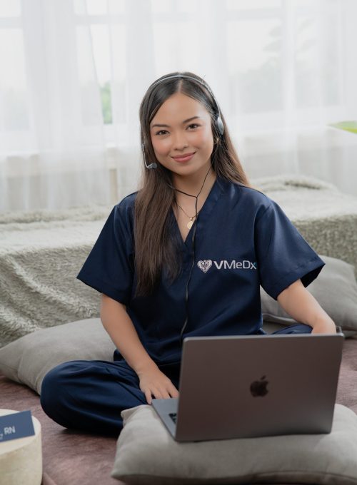 VMeDx VA smiling while headset on the head.